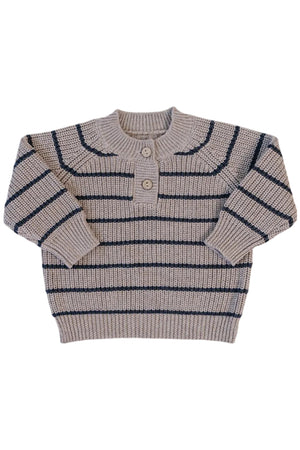 A cozy knit sweater featuring brown and charcoal stripes, with a round neckline and two button closures. This sustainable piece is perfect for casual wear during cooler weather.