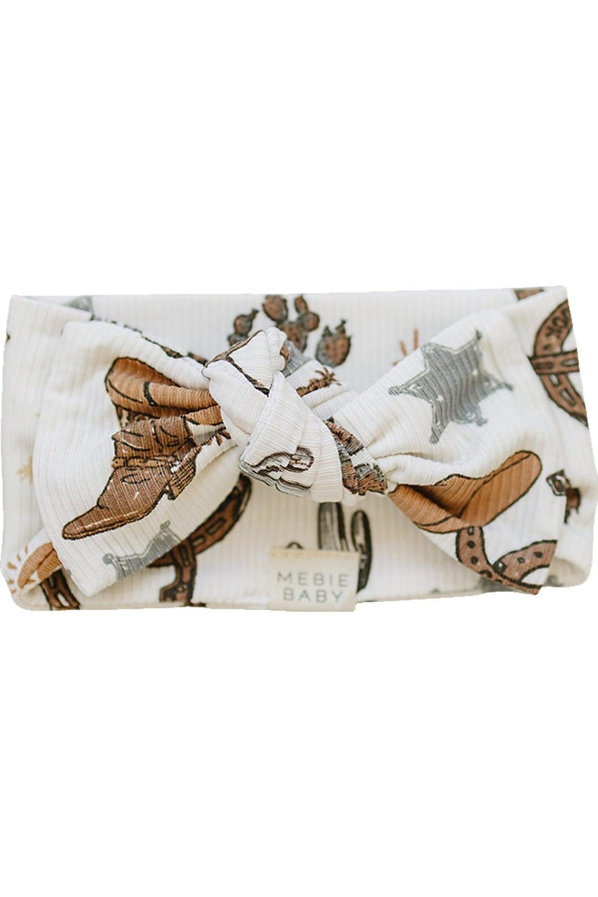 White ribbed baby head wrap with cowboy-themed print, featuring boots and stars. Made by Mebie Baby.
