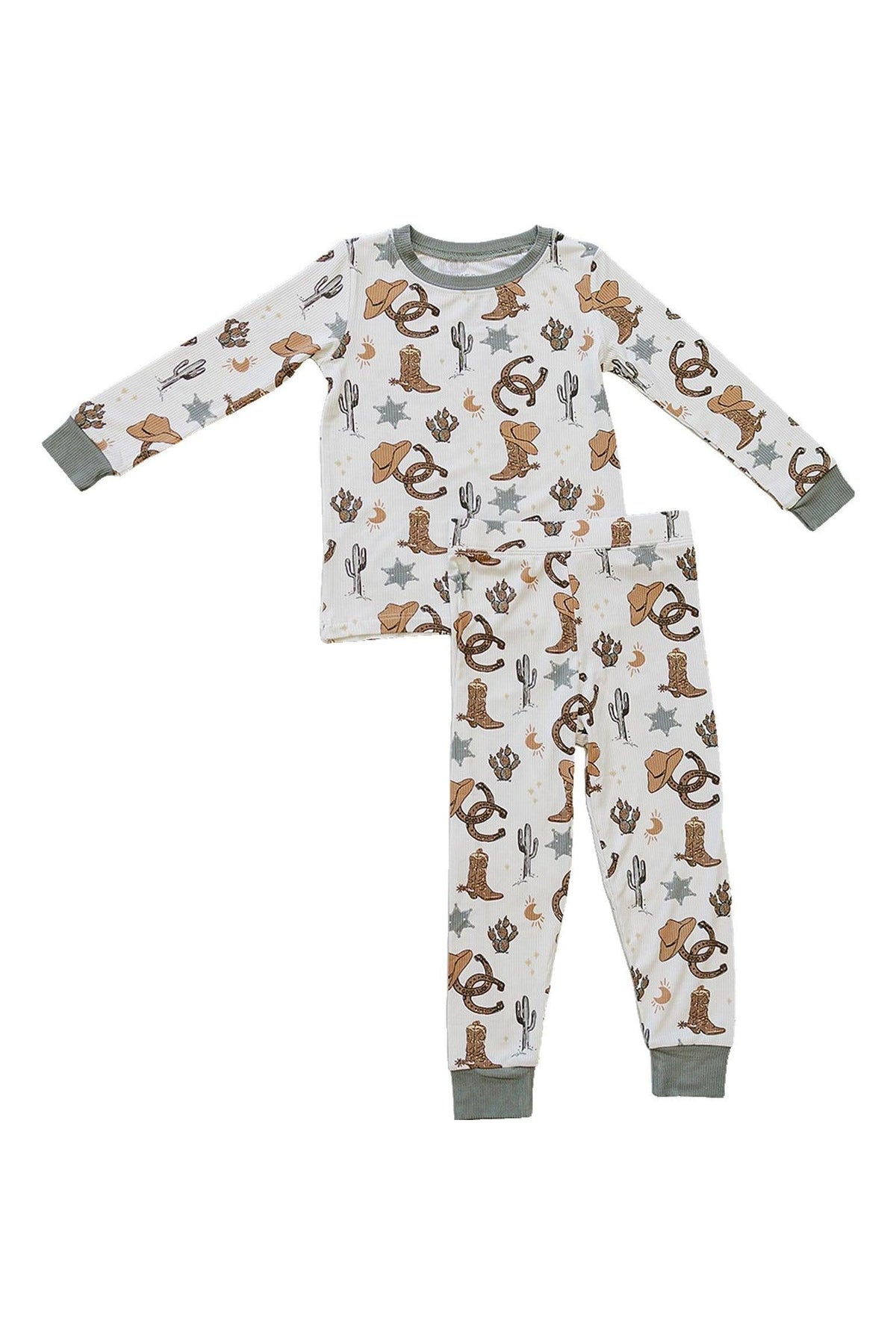 Childrens pajama set with cowboy-themed print, featuring hats, boots, cacti, and stars on white fabric with green cuffs.
