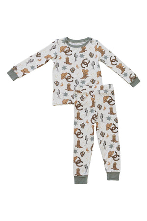 Childrens pajama set with cowboy-themed print, featuring hats, boots, cacti, and stars on white fabric with green cuffs.