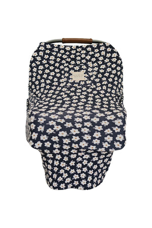 Navy blue baby car seat cover with white daisy pattern and Mebie Baby label, featuring a ribbed texture.