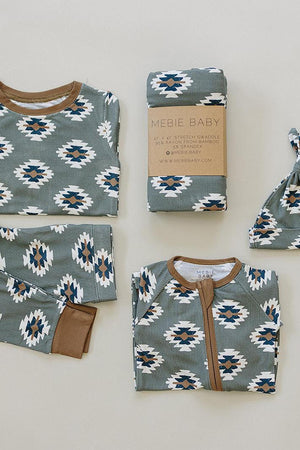 Mebie Baby Southwest Aztec pajama set with bamboo fabric, featuring a green and white pattern, laid flat.