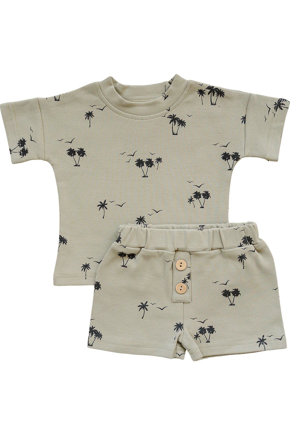 Light beige two-piece shorts set featuring a short-sleeve top and elastic waistband shorts, adorned with a palm tree print in black.