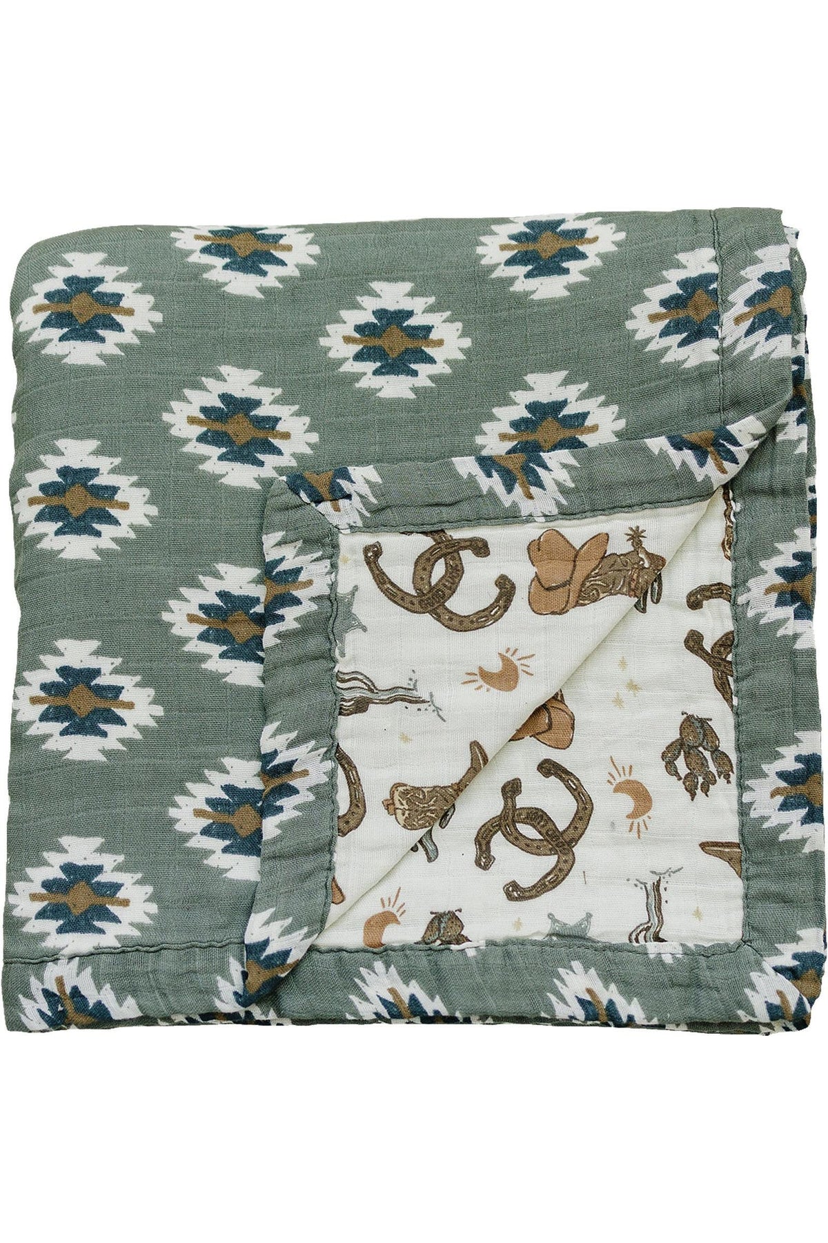 Green muslin crib quilt with Southwest Aztec pattern, featuring a folded corner revealing cowboy-themed illustrations underneath.