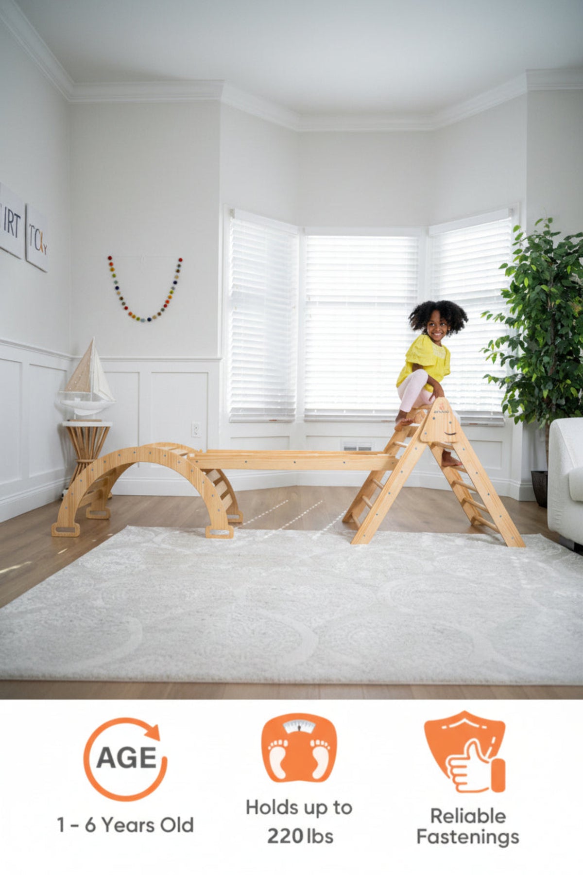 A child plays on a wooden Pikler triangle and slide set in a bright room with white walls and large windows. The natural wood finish highlights its sustainable, eco-friendly design.