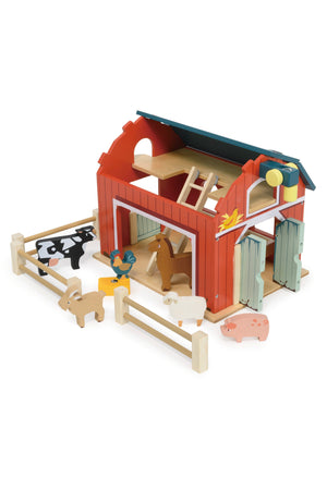 Toy barn set with animals on a white background