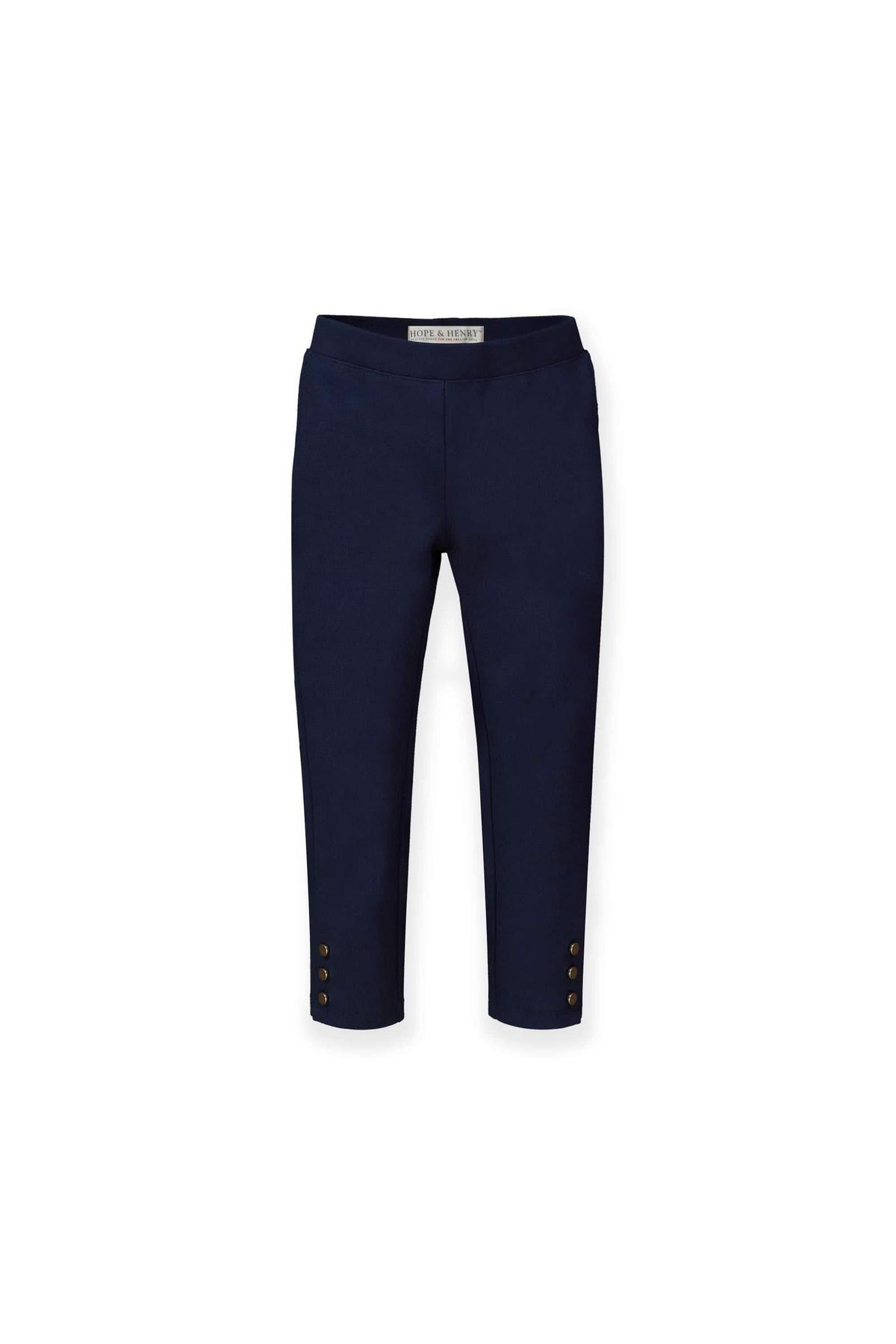 Navy organic cotton ponte pants feature a slim silhouette and stylish button cuffs, ideal for toddlers and girls. These versatile pants offer comfort and a polished look for everyday wear.