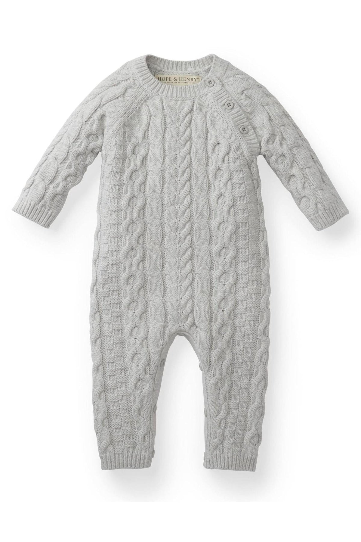 Light gray organic cotton cable knit sweater romper featuring long sleeves and button openings at the shoulder and inner legs, perfect for babies aged 0-24 months.