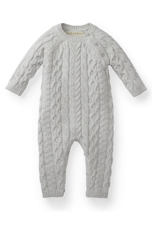 Light gray organic cotton cable knit sweater romper featuring long sleeves and button openings at the shoulder and inner legs, perfect for babies aged 0-24 months.