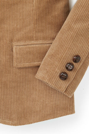 Close-up of a medium brown corduroy blazer for boys, featuring button details and a textured fabric.