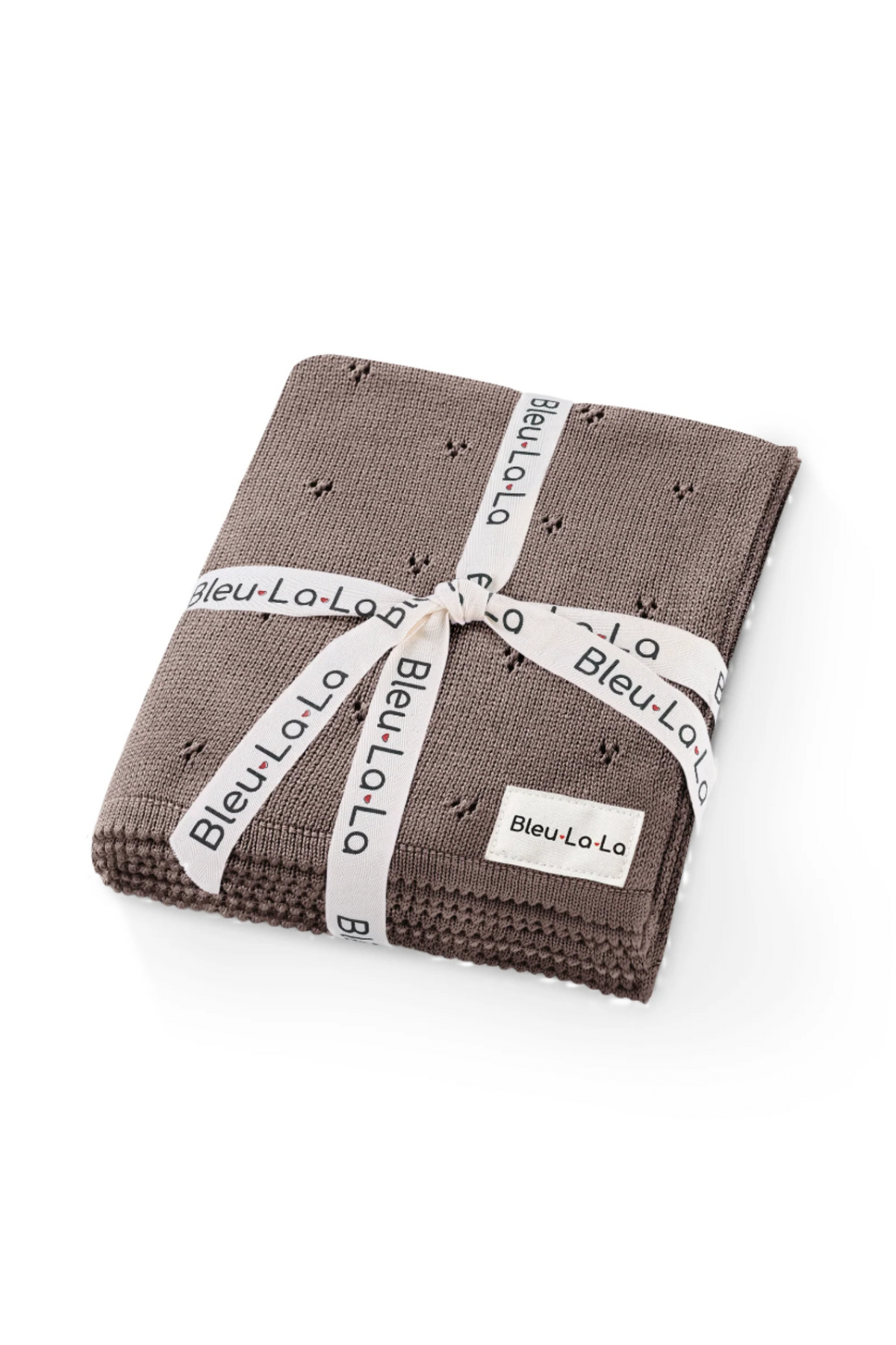 Brown knitted blanket with pointelle pattern, tied with a branded ribbon, featuring a Bleu-La-La label.