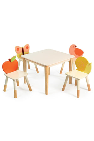 Children’s table with four wooden chairs featuring colorful animal and fruit designs, perfect for playful and creative activities.