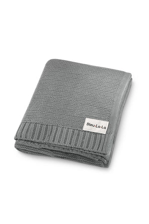 A folded gray knit baby blanket with a ribbed border and a Bleu La La label.