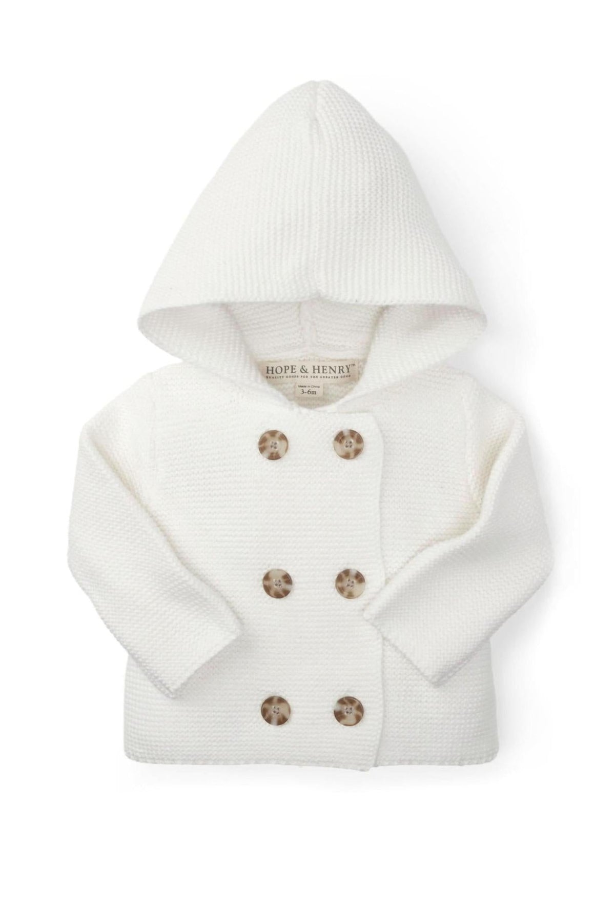 A soft white hooded sweater from Hope & Henry, featuring a seed stitch knit and double-breasted button front for baby.