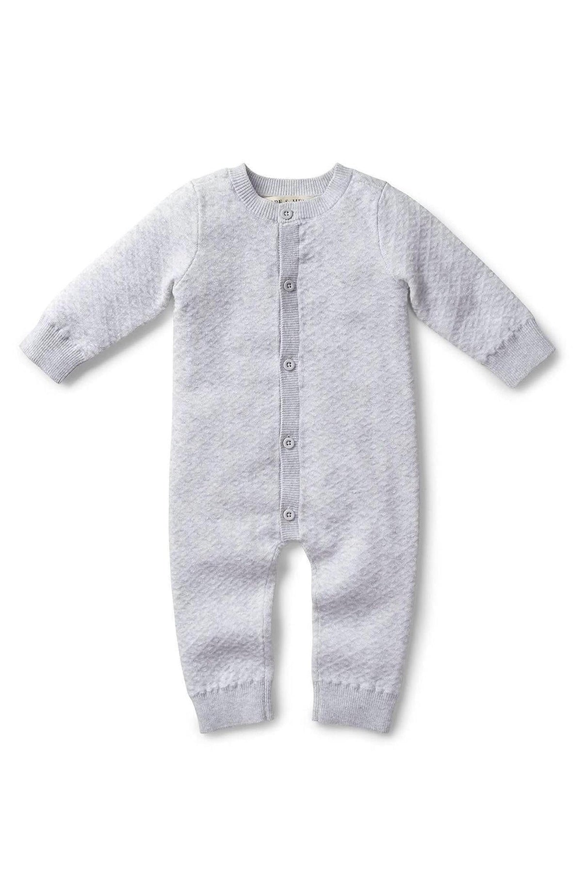 Gray organic cotton sweater romper featuring a textured diamond pattern, center front button closure, and long sleeves for babies.