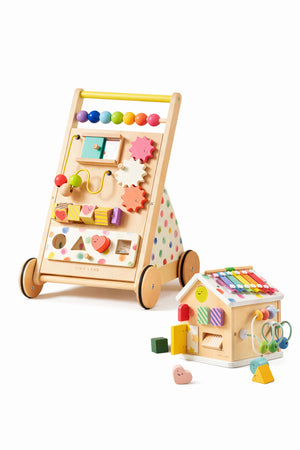 A colorful wooden baby walker with activity features, including shapes and beads, alongside a cheerful wooden house playset.