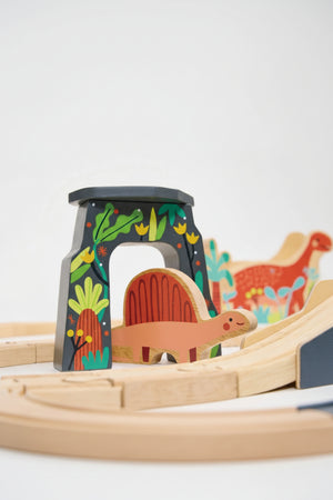 Colorful wooden dinosaur railway set with painted arch and dinosaur figures, featuring eco-friendly materials for imaginative play.