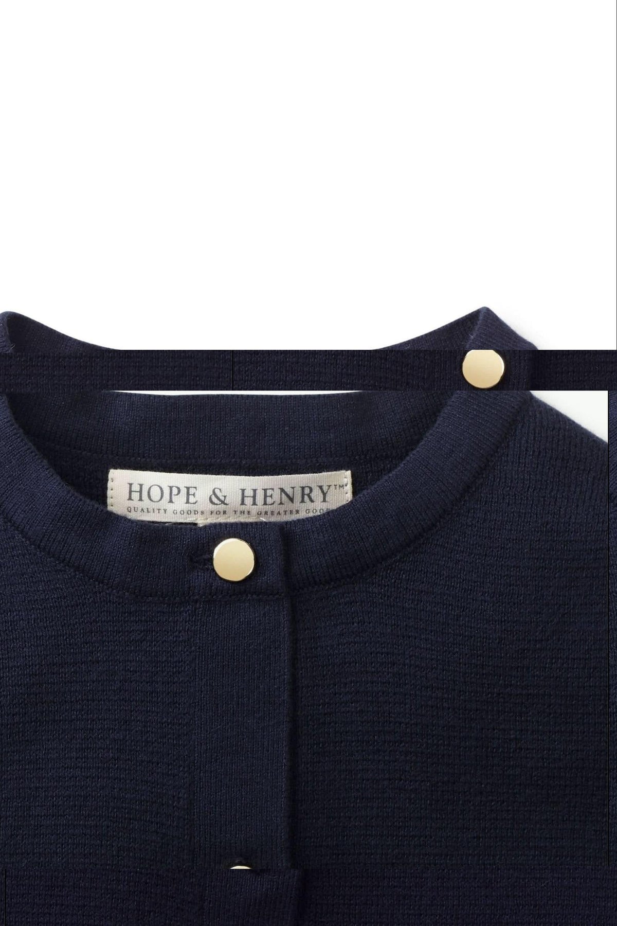 Close-up of a navy blue Hope & Henry cardigan featuring a Milano stitch, gold buttons, and a soft knit texture.