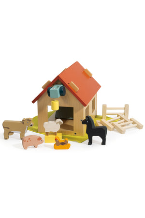 A colorful wooden farm playset features a barn with a red roof, surrounded by various animal figures including a sheep, pig, and horse, promoting imaginative play for young children.