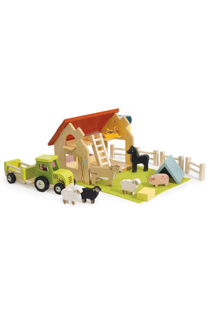 Colorful wooden farm playset featuring a barn, tractor, and various animal figures, designed for imaginative play. The eco-friendly materials and bright colors are perfect for young children.