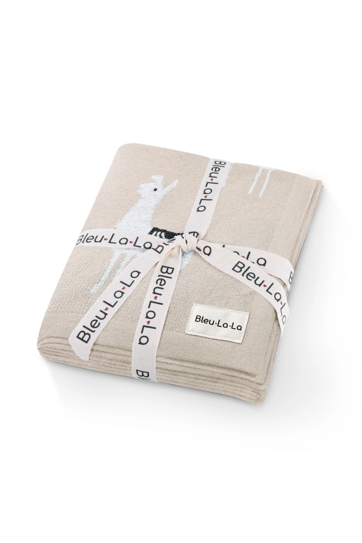 A beige knit blanket with a llama design, tied with a branded ribbon labeled Bleu La La.