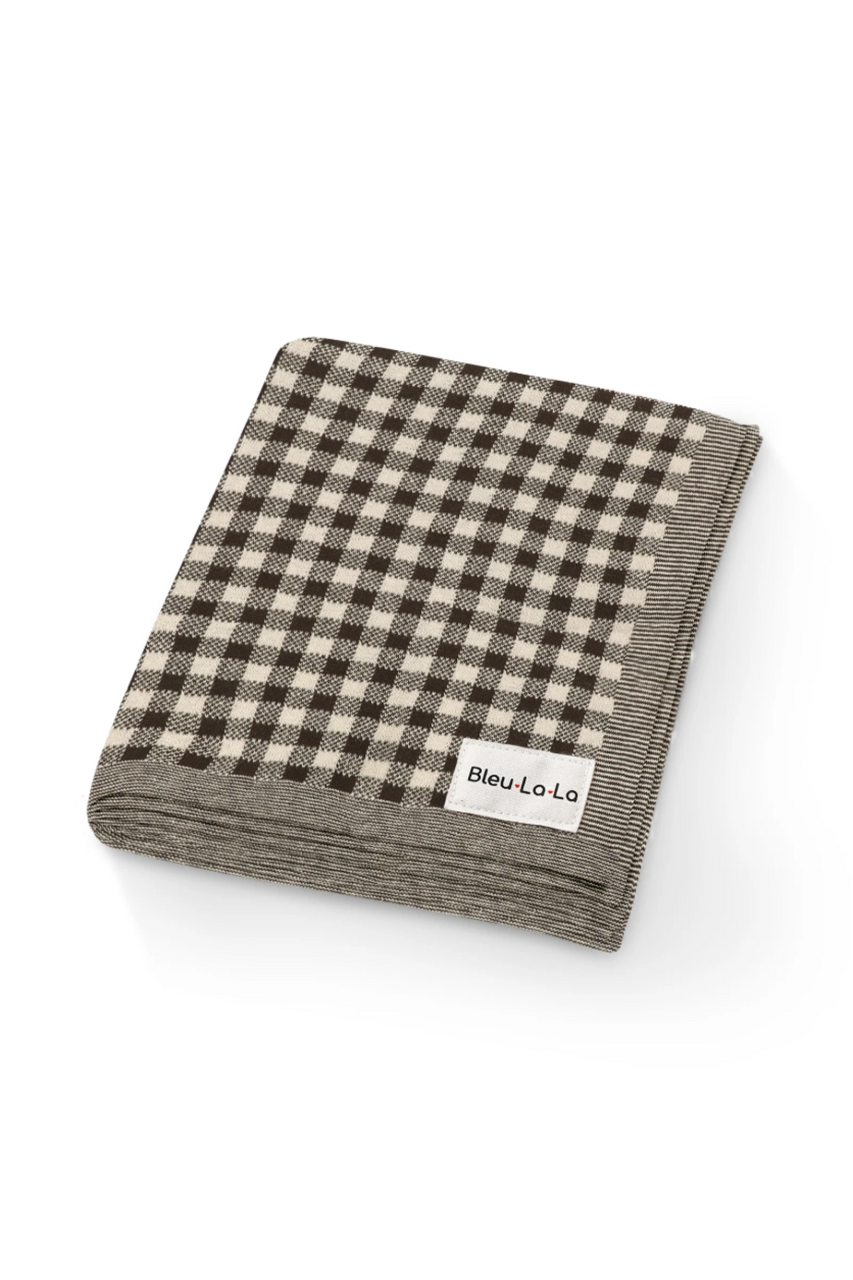 Folded checkered knit blanket with a black and cream pattern, featuring a Bleu La La label on the corner.