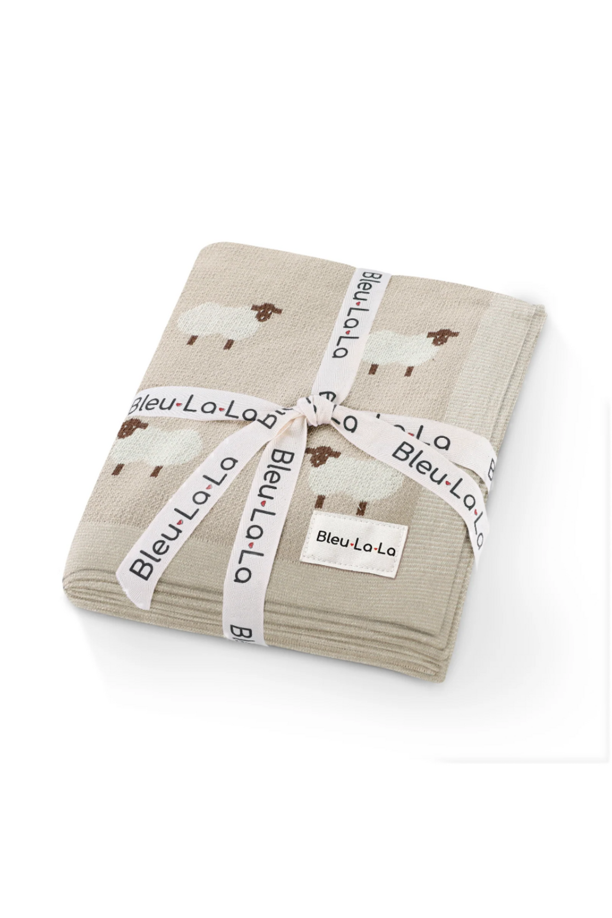Folded beige blanket with sheep pattern, tied with a branded Bleu-La-La ribbon on a white background.