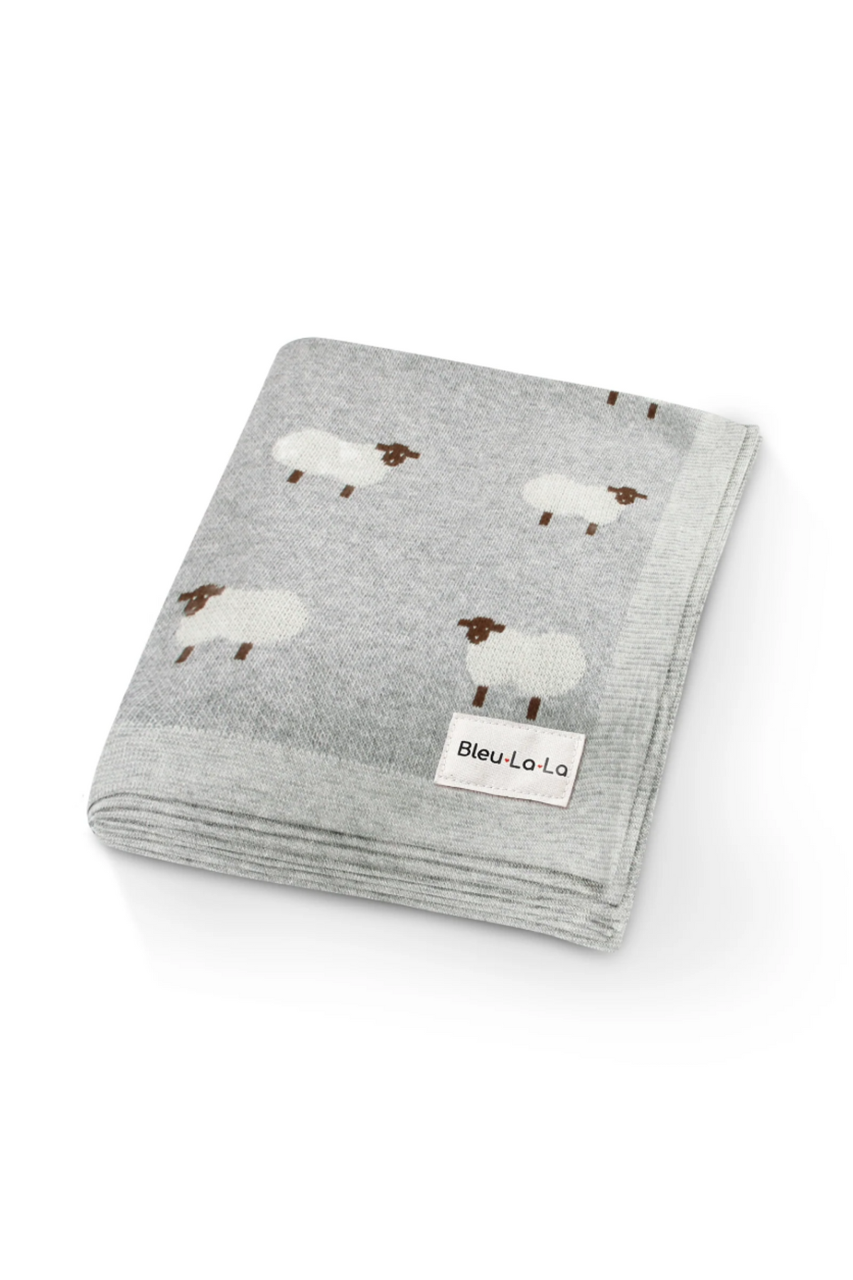 Gray knit blanket with white sheep pattern, featuring a Bleu La La label. Made from soft, cozy fabric.
