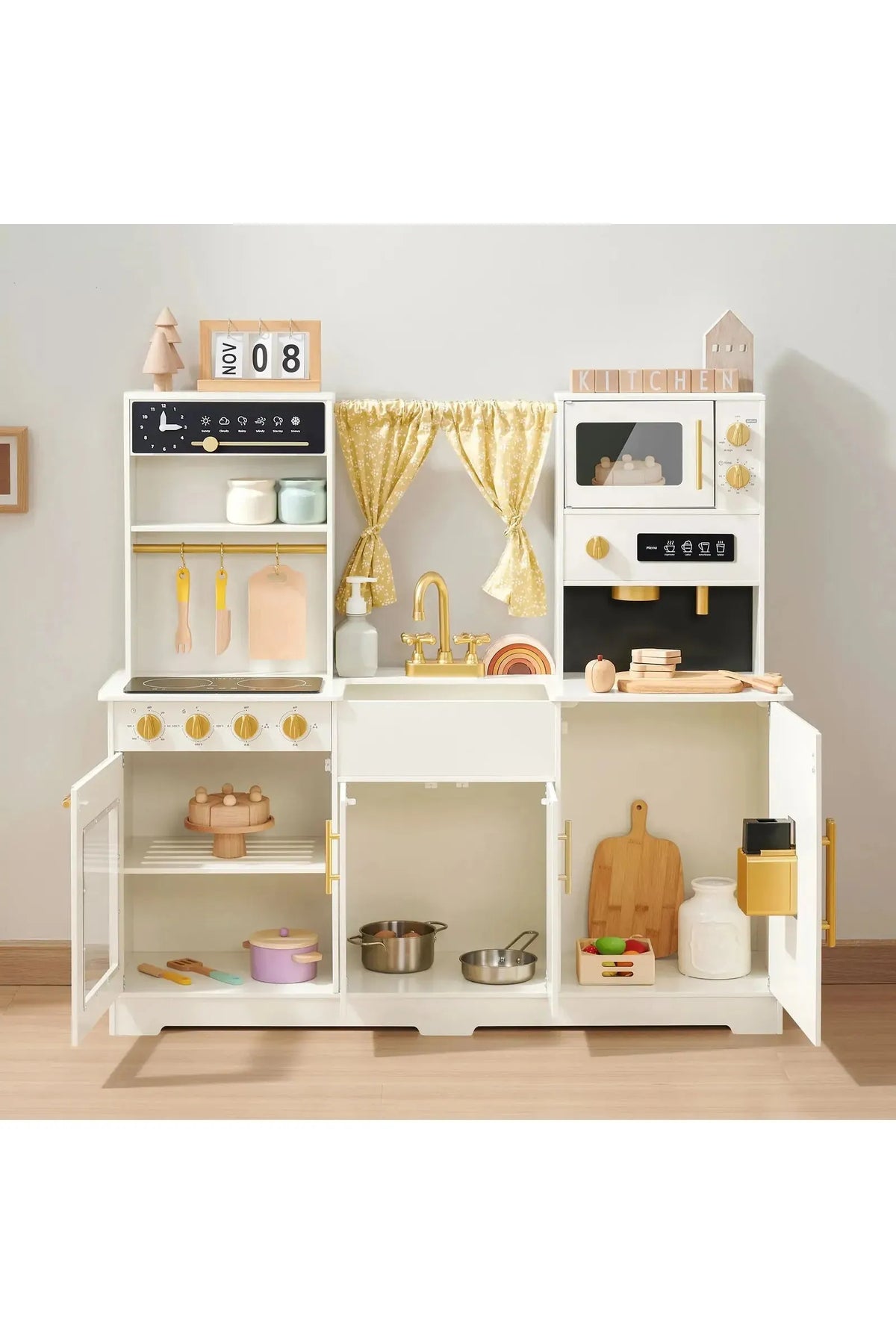 A cream-colored wooden play kitchen features gold accents, realistic appliances, and open storage. Designed by Tiny Land, it encourages imaginative play for toddlers and kids with safe, sustainable materials.