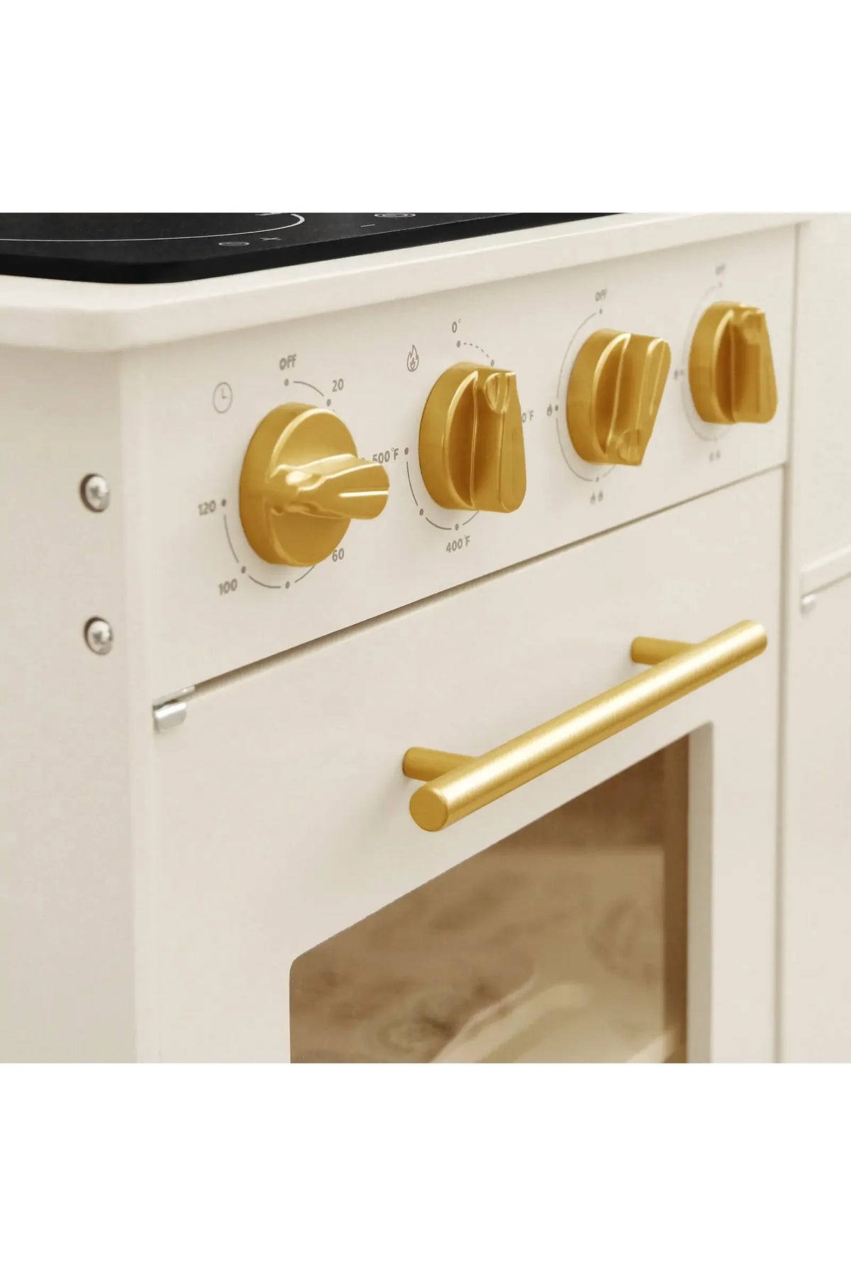 Close-up of the Tiny Land® wooden play kitchen, featuring a cream-colored design with gold knobs and handles.
