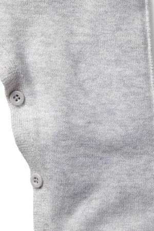 Close-up of a light heather grey organic cotton baby romper featuring soft rolled edges and buttons on the shoulder, showcasing its gentle fabric and sustainable design for infants.