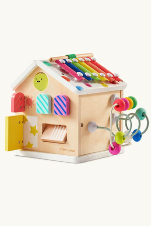 Montessori-inspired Tiny Land® wooden activity cube featuring colorful interactive surfaces, designed for toddlers with safe, child-friendly materials.