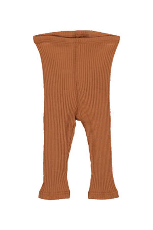 Rust-colored cotton leggings with a ribbed texture are displayed beside a small decorative flower. These soft, stretchy leggings are perfect for babies and kids, offering comfort and style.