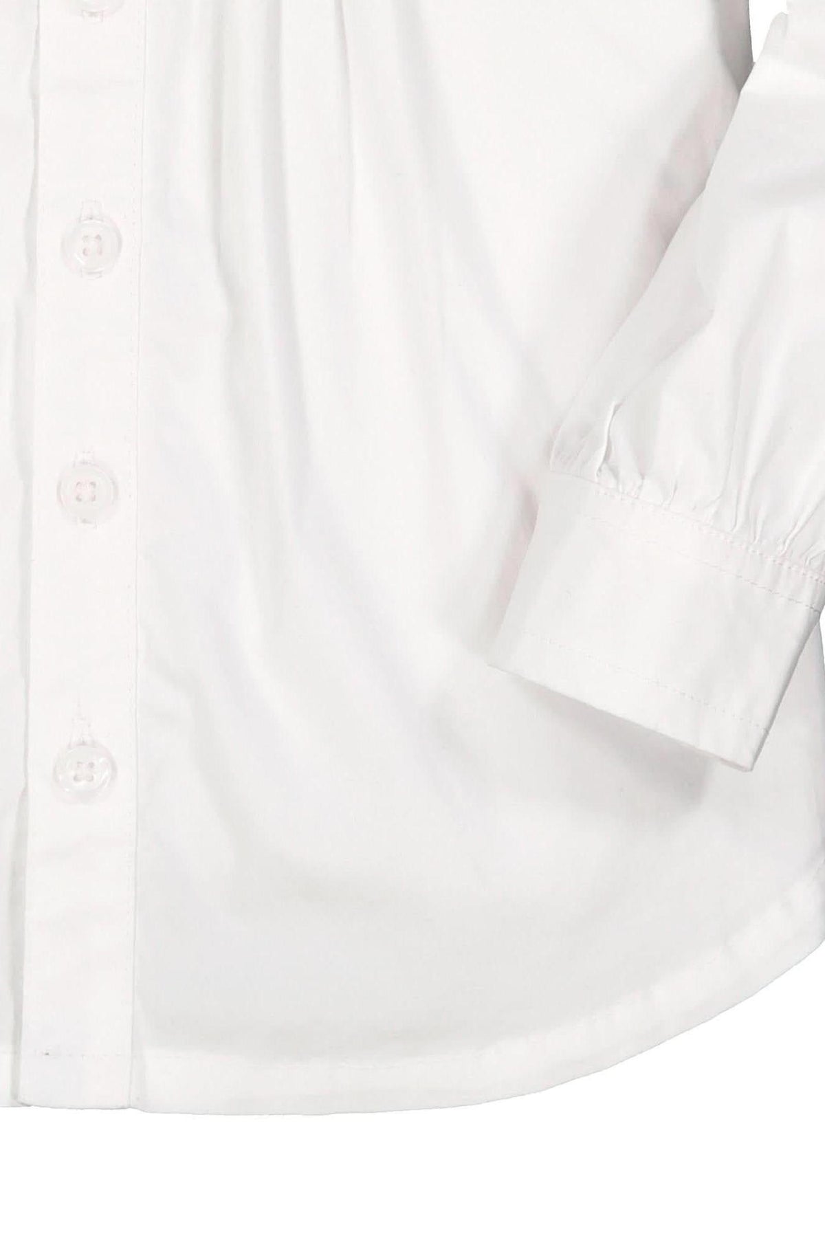 Close-up of a white blouse featuring button details, a ruffled collar, and pintucks on the front yoke, ideal for baby.