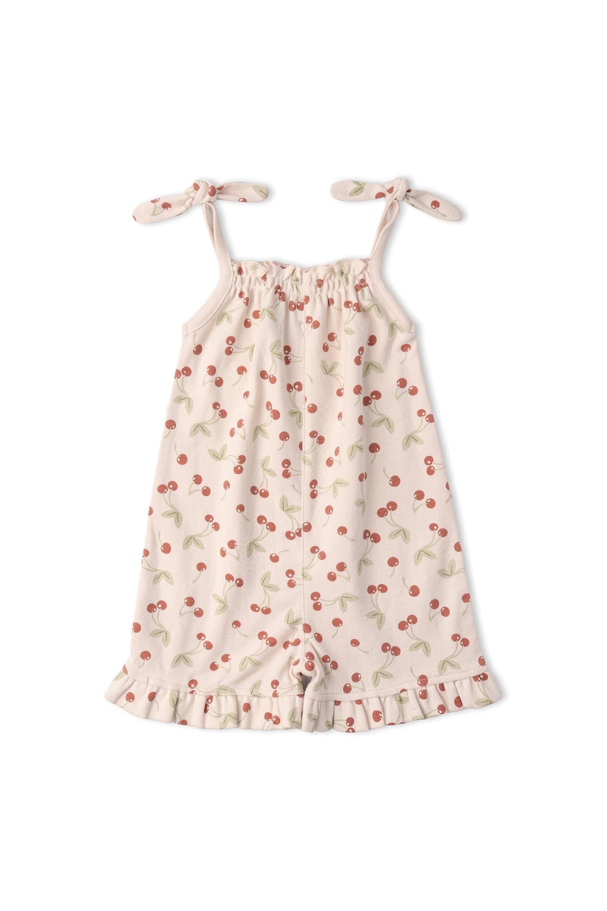 Light pink ruffle jumpsuit featuring a cherry print with adjustable tie straps. Made from organic cotton, this playful outfit is perfect for warm-weather adventures for young children.