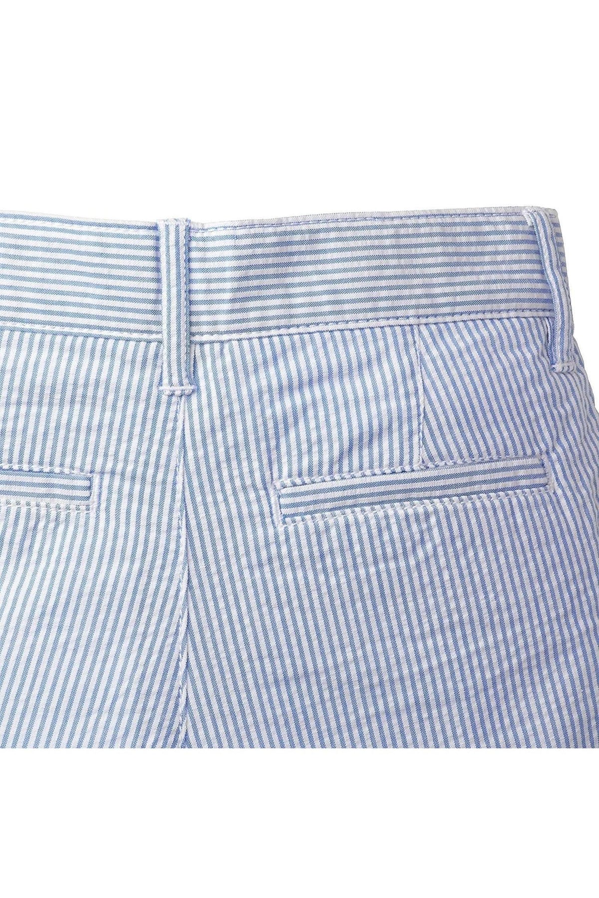 Close-up of the back waistband of organic cotton seersucker shorts, featuring a light blue and white striped pattern, with two back welt pockets and a neat, tailored finish.