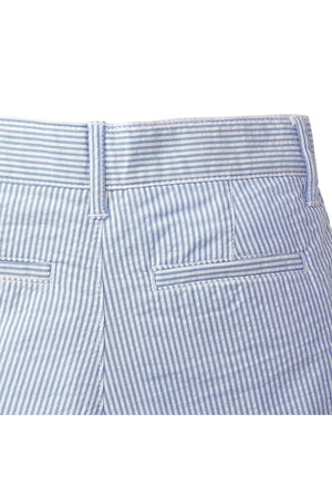 Close-up of the back waistband of organic cotton seersucker shorts, featuring a light blue and white striped pattern, with two back welt pockets and a neat, tailored finish.