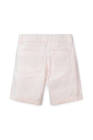 Light pink organic cotton seersucker baby shorts featuring a classic check pattern and two back pockets. Designed for comfort and style, perfect for everyday wear and special outings.