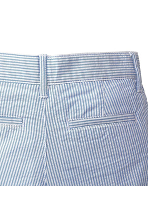 Close-up of the back of classic seersucker suit pants in light blue and white stripes, featuring a tailored waistband and two back pockets.