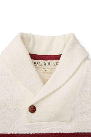 Close-up of a Hope & Henry ivory organic cotton shawl collar sweater featuring a brown button and a maroon stripe.