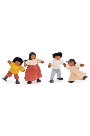 Four wooden dolls with bendy limbs, wearing colorful knitted and muslin clothes, stand against a white background.