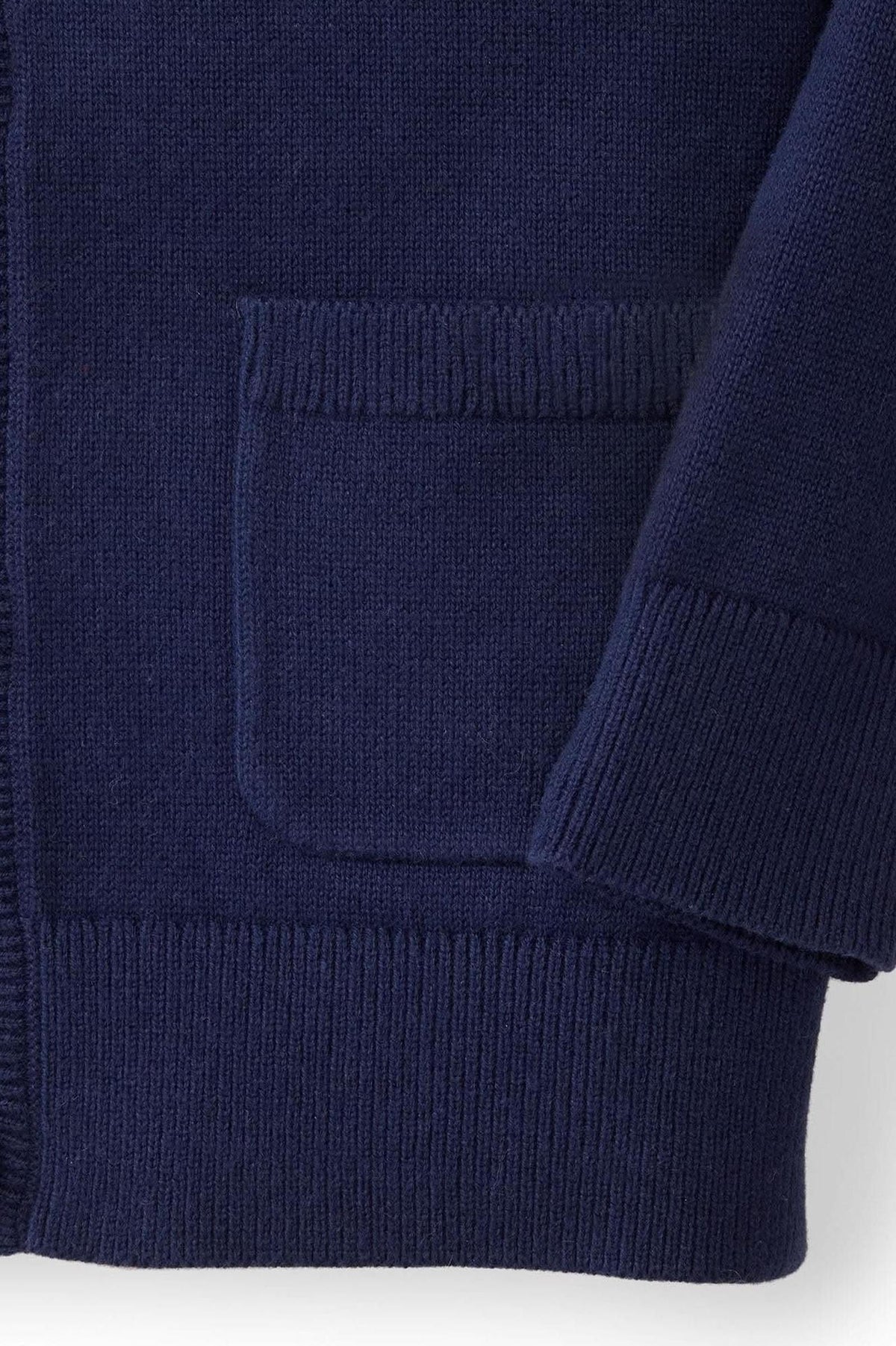Navy blue knit cardigan with a front pocket and ribbed trim, made from soft organic cotton fabric.