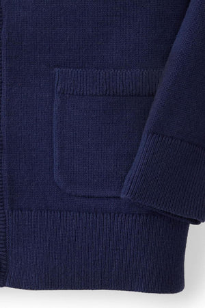 Navy blue knit cardigan with a front pocket and ribbed trim, made from soft organic cotton fabric.