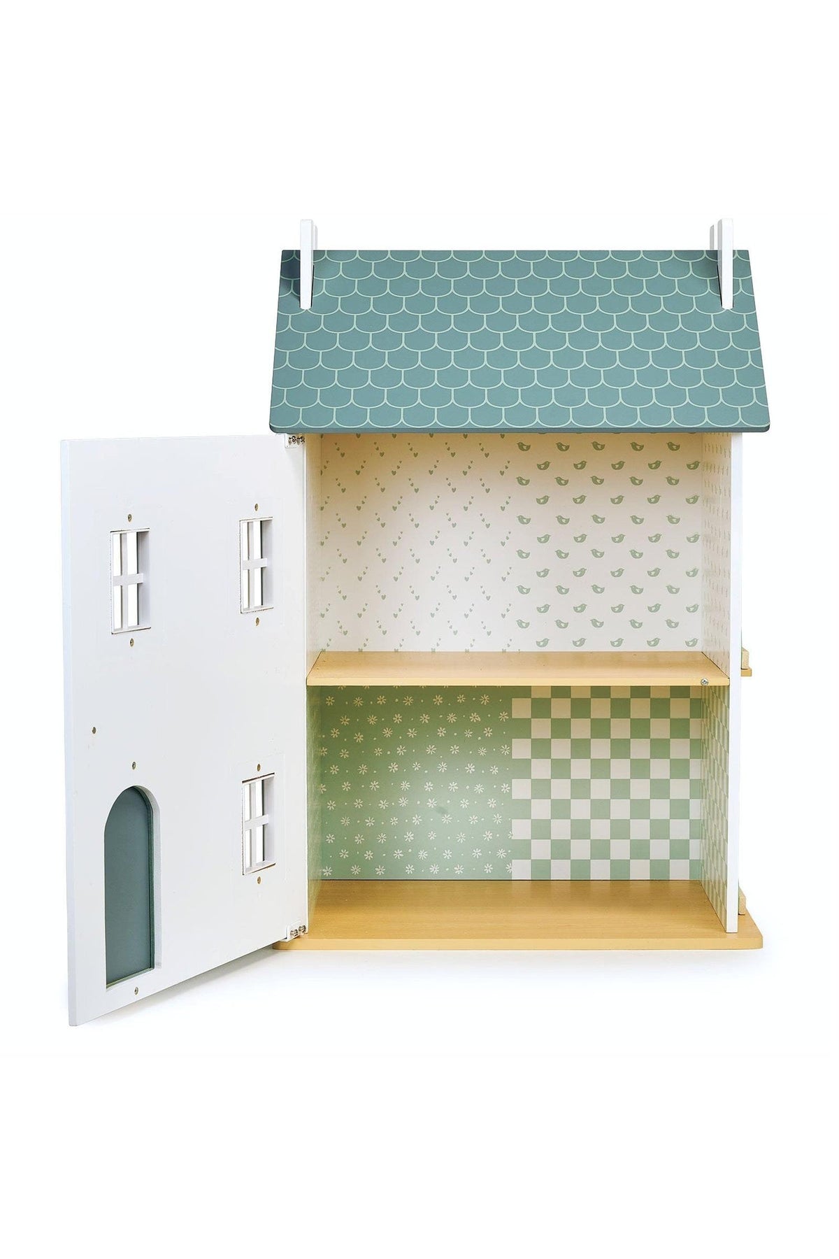 Children's dollhouse with a green roof and patterned walls on a white background