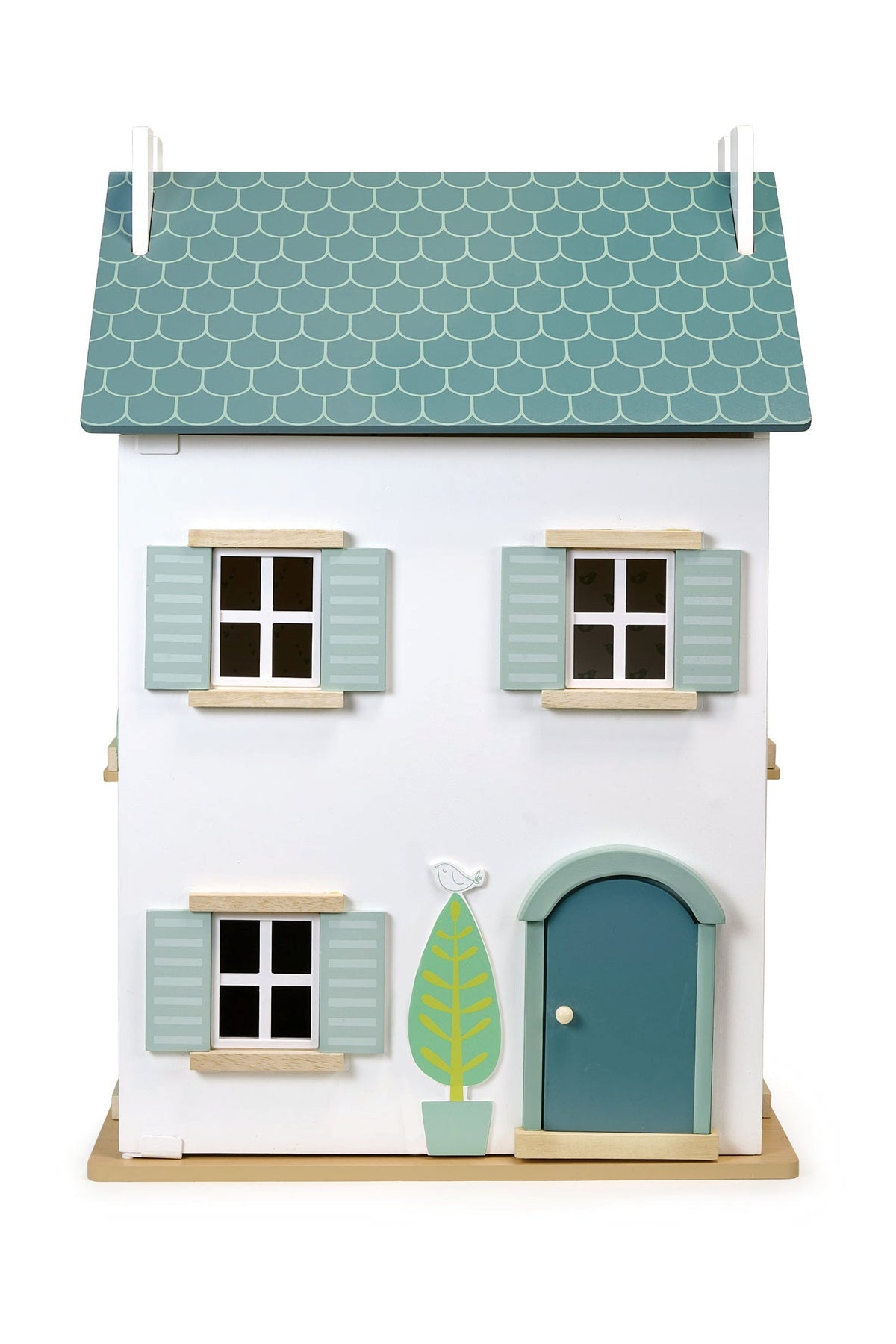 Model of a small house with a green roof and door on a white background