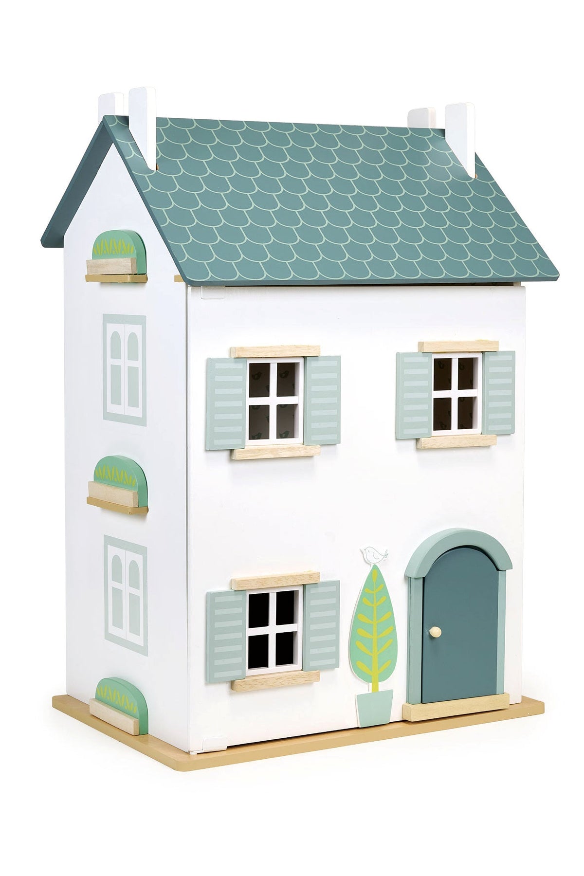 Toy dollhouse with a green roof and white walls on a white background